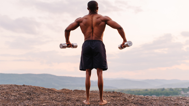 Fit Guy Lifting Dumbbells With A Big Upper Body and Skinny Legs